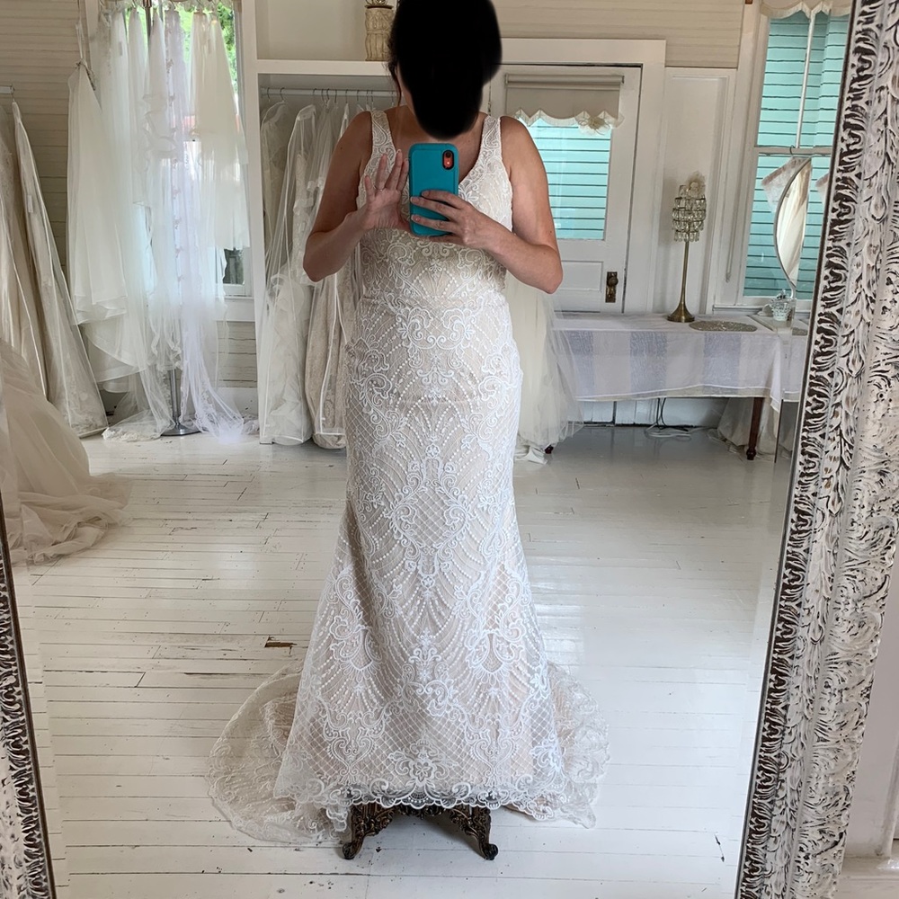 Ivory wedding dress new with tags.